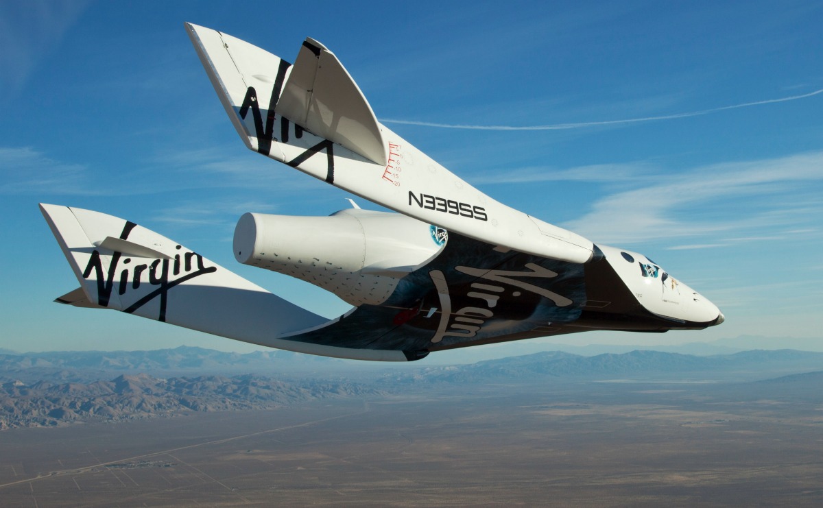 the Virgin Galactic SpaceShip2 (VSS Enterprise) glides toward earth on its first test flight after release from the mothership, "WhiteKnight2" (VMS Eve) over the Mojave, Ca. area early Sunday October 10. The craft was piloted by engineer and test pilot Pete Siebold from Scaled Composites.