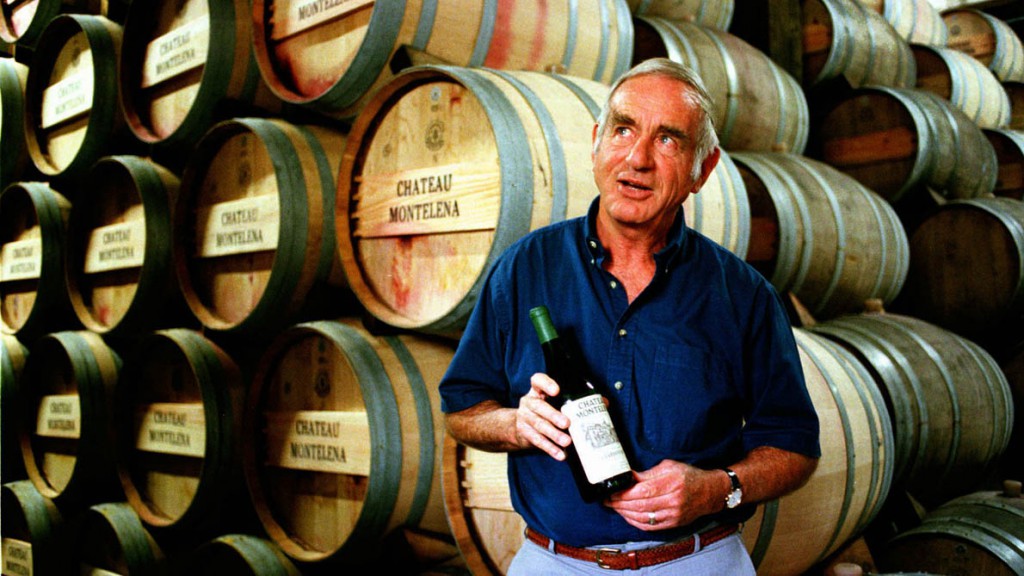 Jim Barrett, owner of Chateau Montelena in Napa Valley, holds a bottle of the 1973 chardonnay that won the 1976 Paris Tasting, in 1996. Barrett died Thursday at 86.